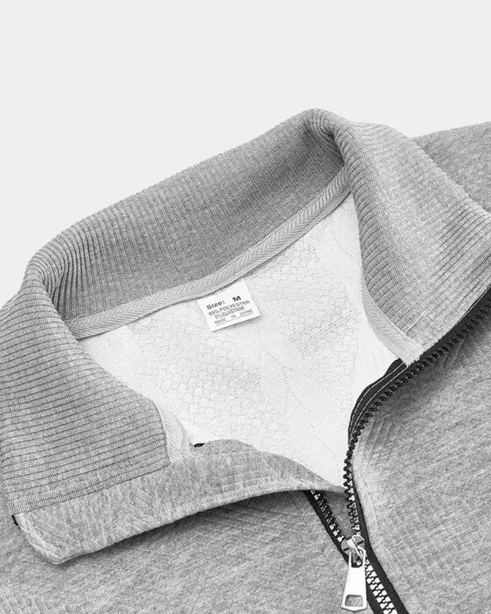 Jentje | Crèmekleurige kabeltrui met halve rits