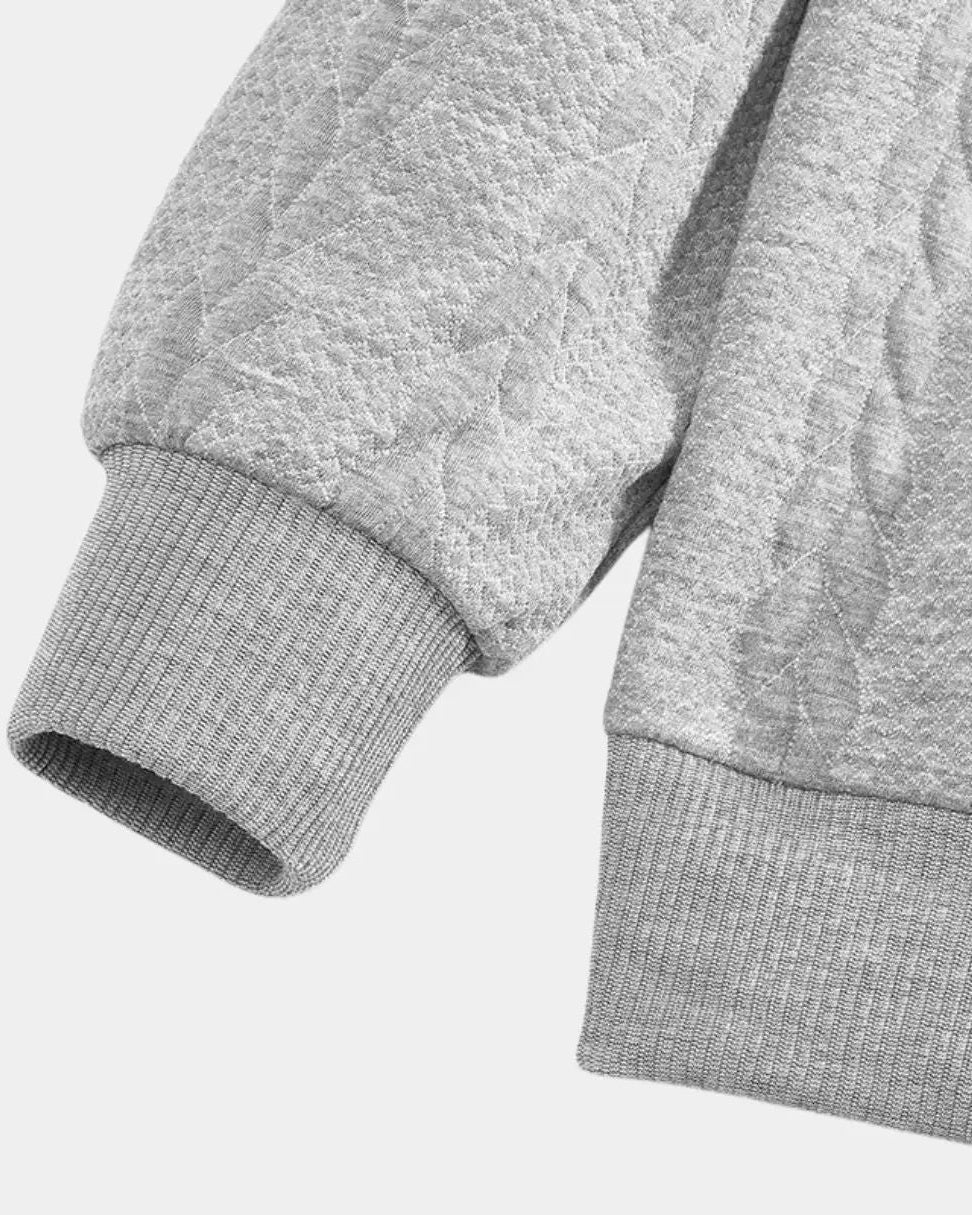 Jentje | Crèmekleurige kabeltrui met halve rits