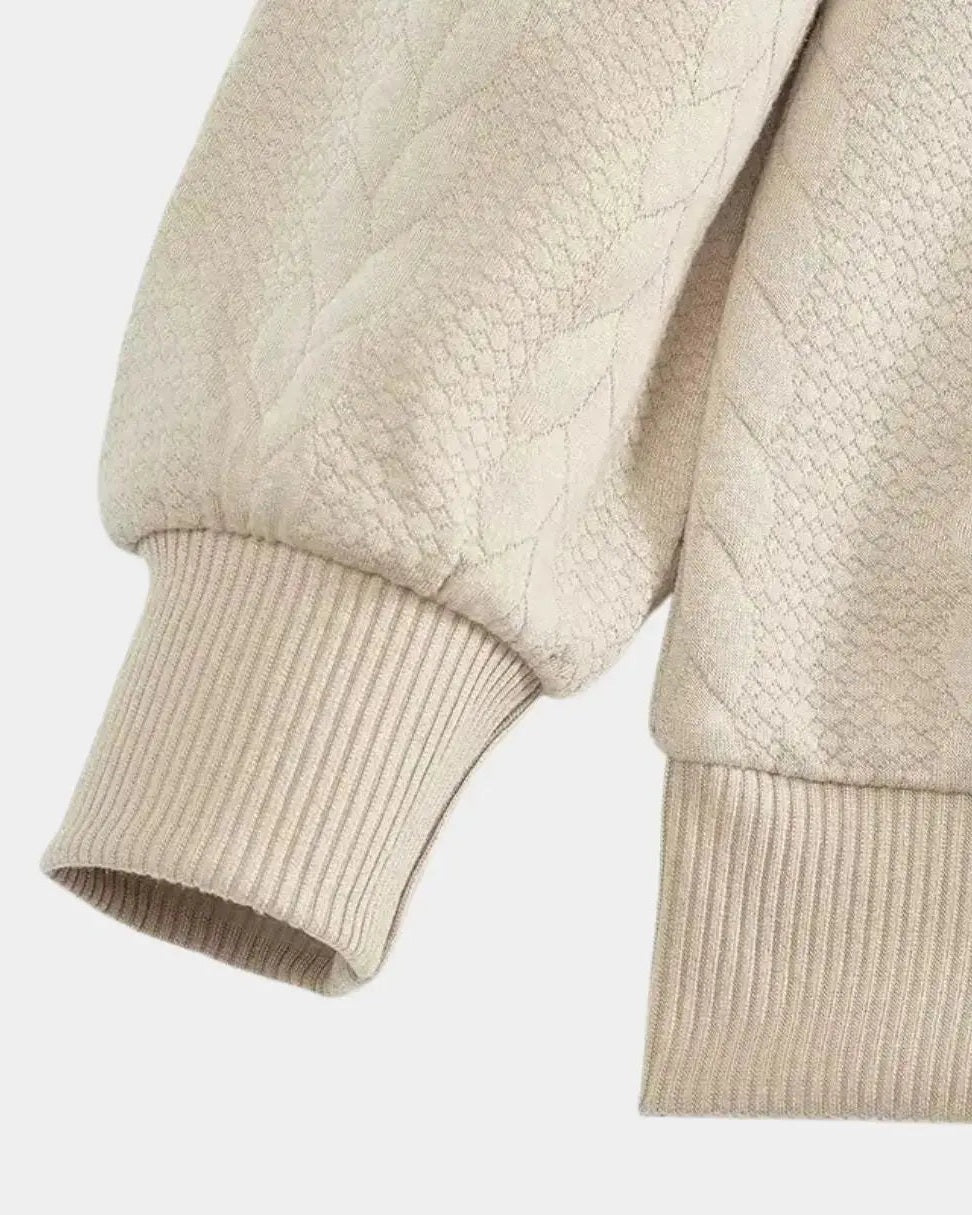Jentje | Crèmekleurige kabeltrui met halve rits
