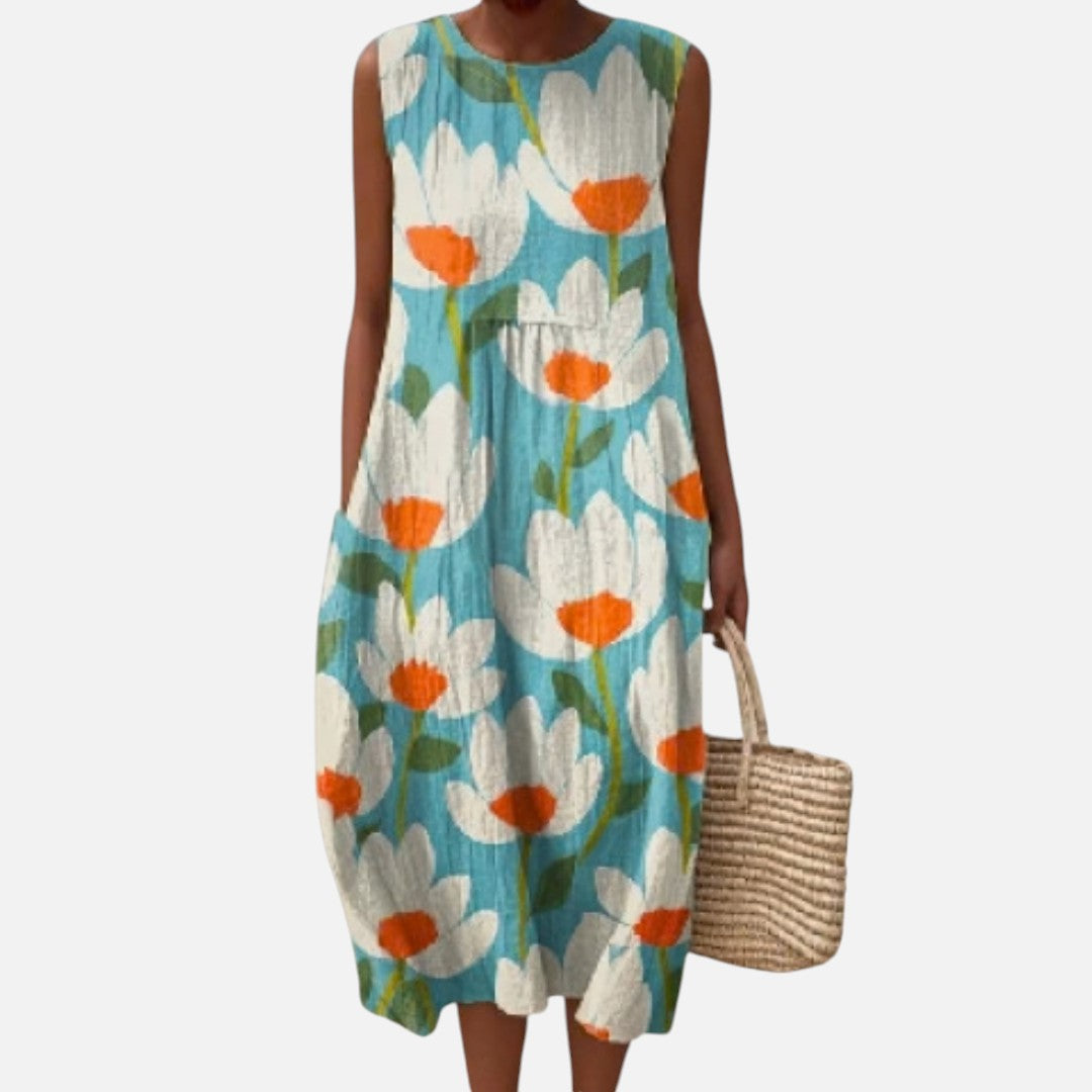 Ria | Mouwloze midi-jurk met bloemen op turquoise